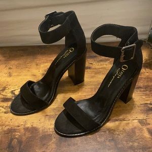 Size 7 black heels with an ankle strap